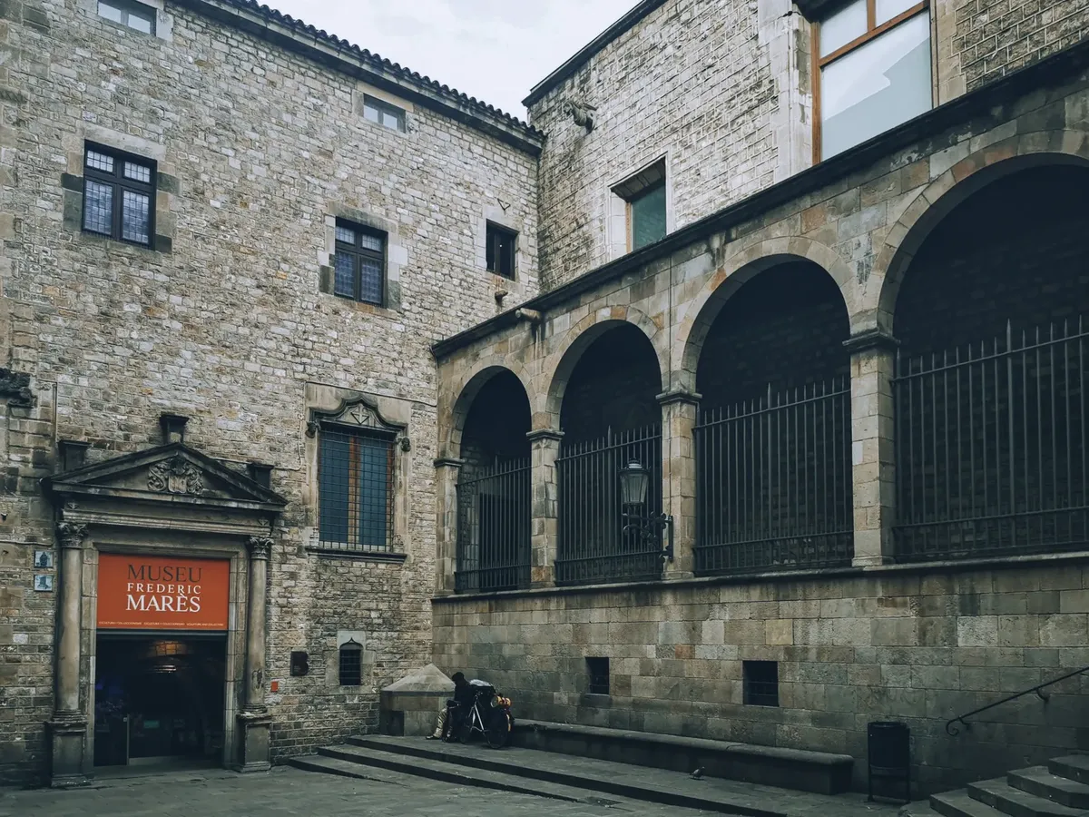The historic Frederic Marès Museum in Barcelona featuring stone arches and medieval architecture.