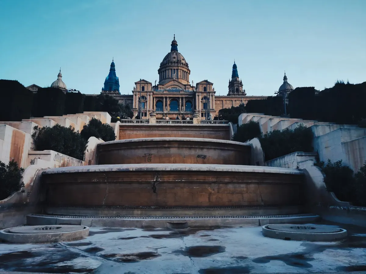 Stunning view of Palau Nacional with the empty Magic Fountain of Montjuïc during daytime in Barcelona.